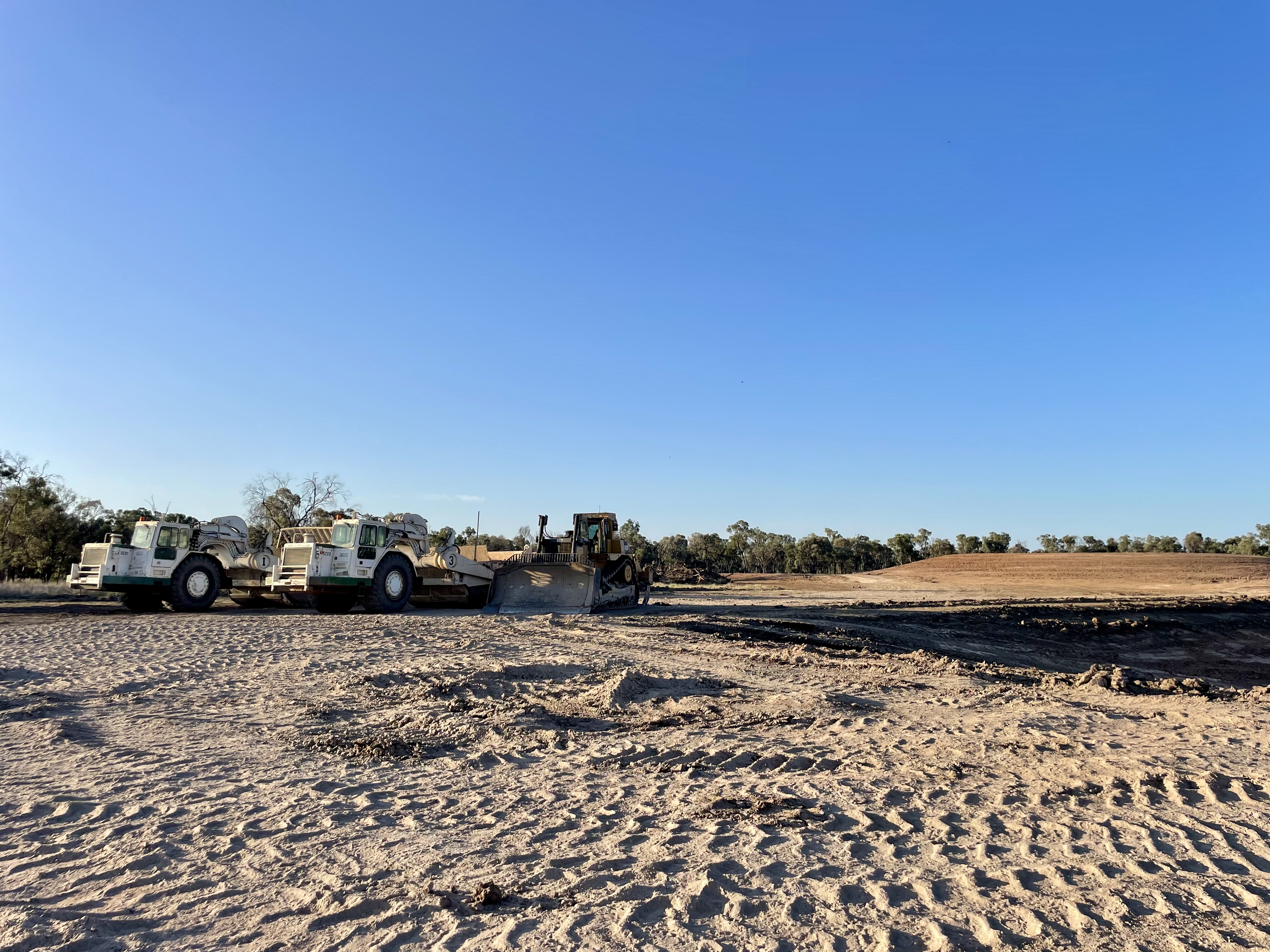 HE Earthmoving CAT scrapers and dozers working on site in Central Queensland