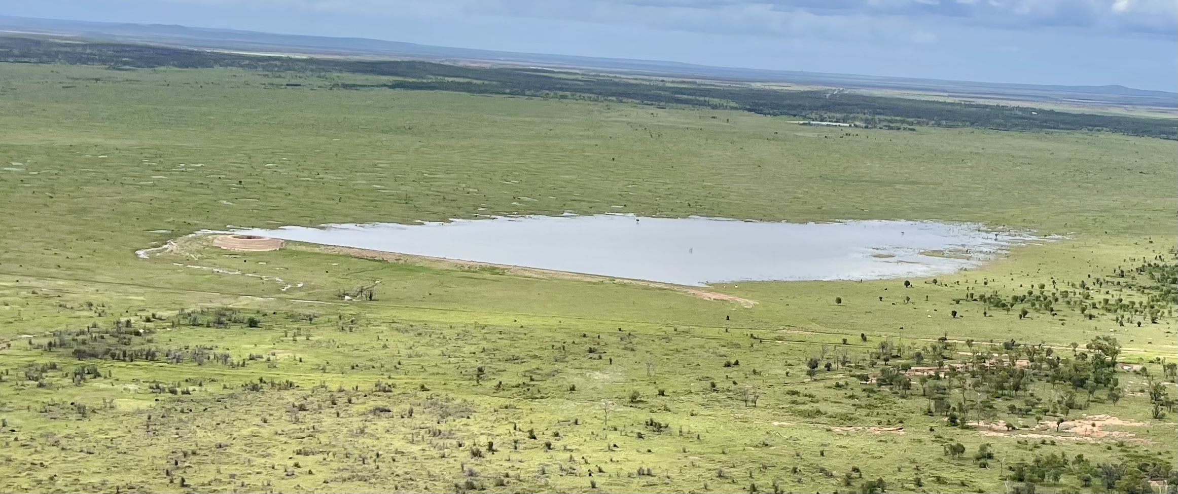 Completed dam full of water on a Queensland pastoral property built by HE Earthmoving