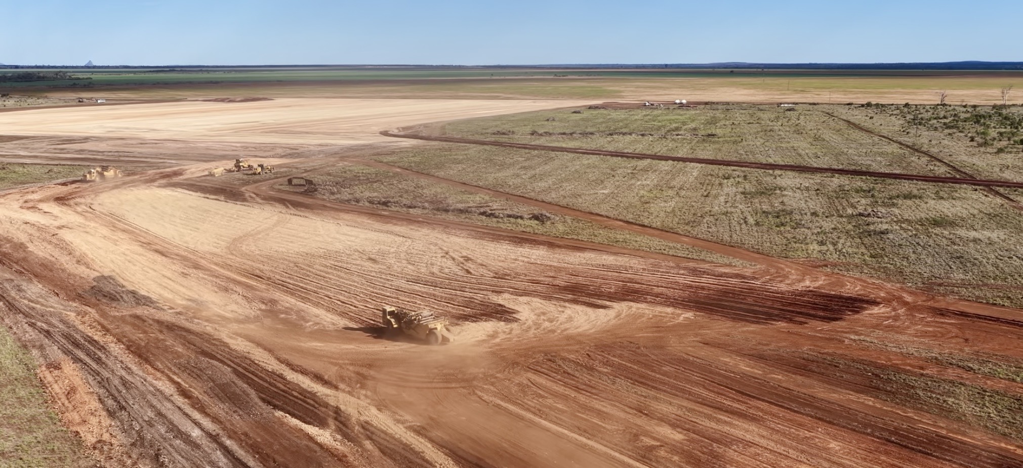 Aerial view of large-scale earthworks by HE Earthmoving across open plains in Queensland