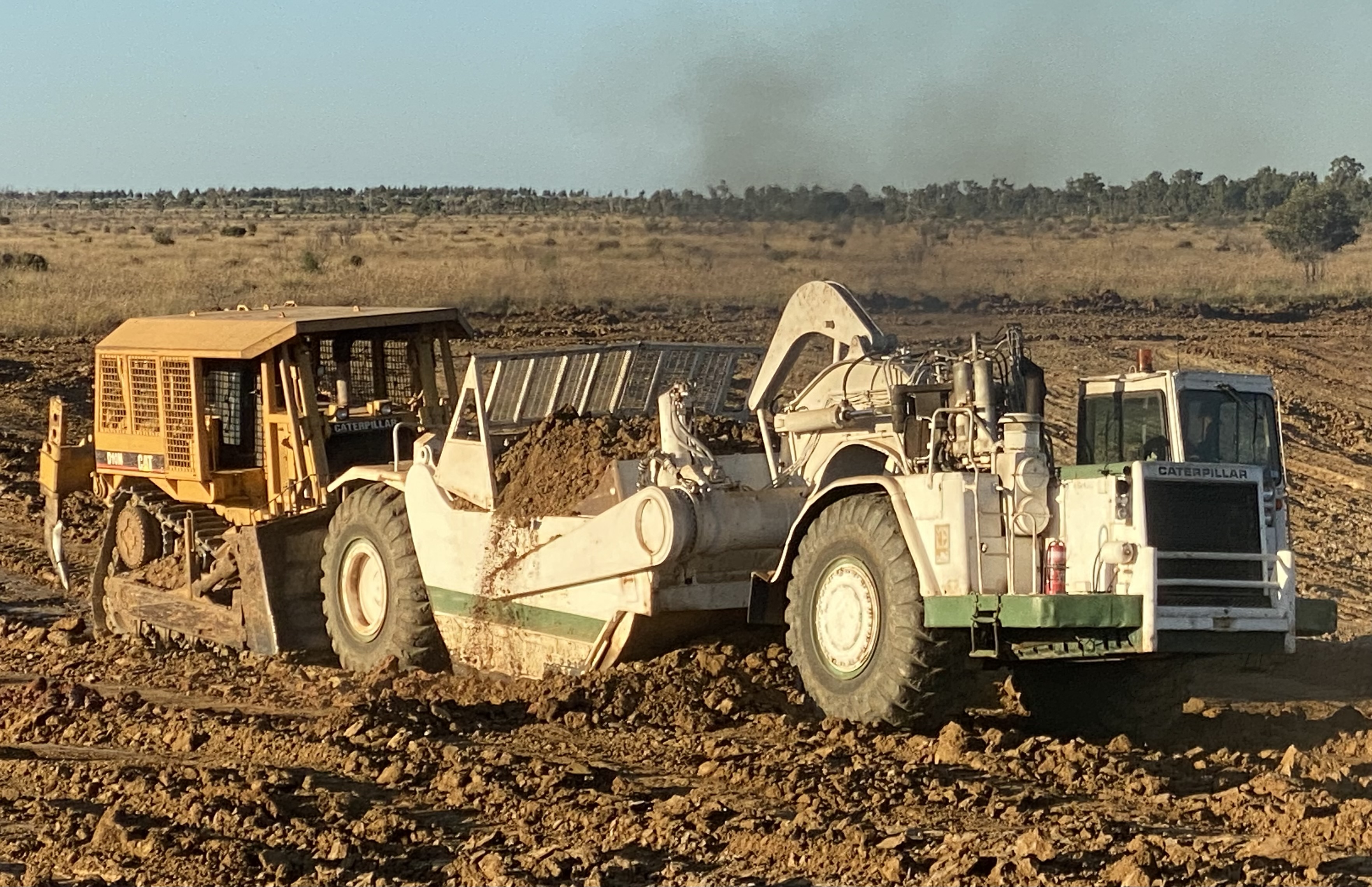 CAT scrapers working together on a Central Queensland earthworks site