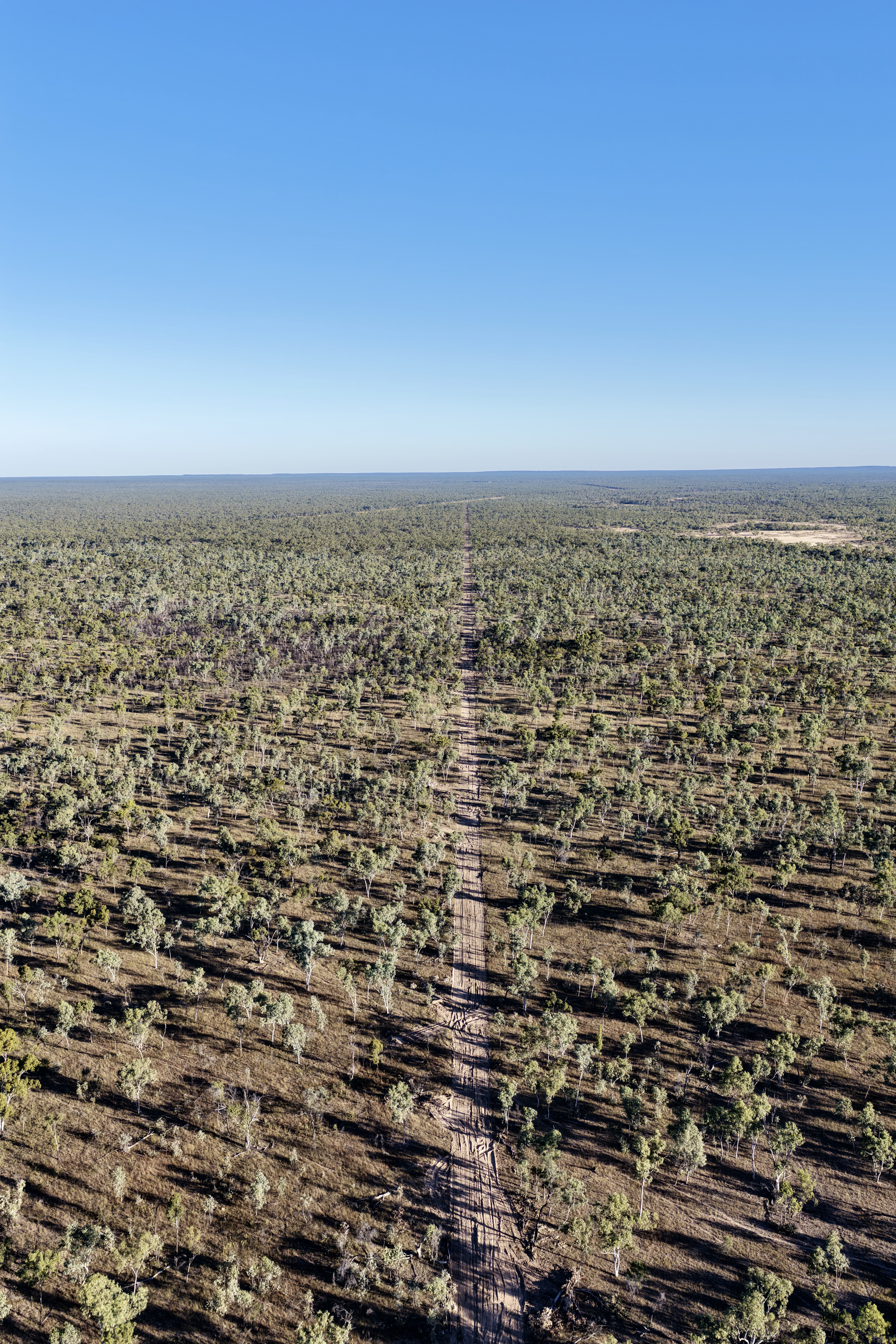Land clearing through Queensland bushland by HE Earthmoving showing cleared path